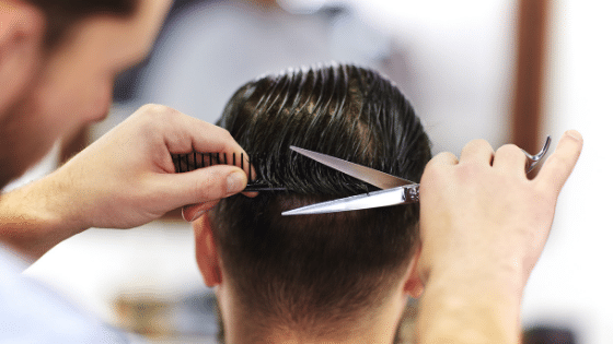 man getting haircut | Laser Cap