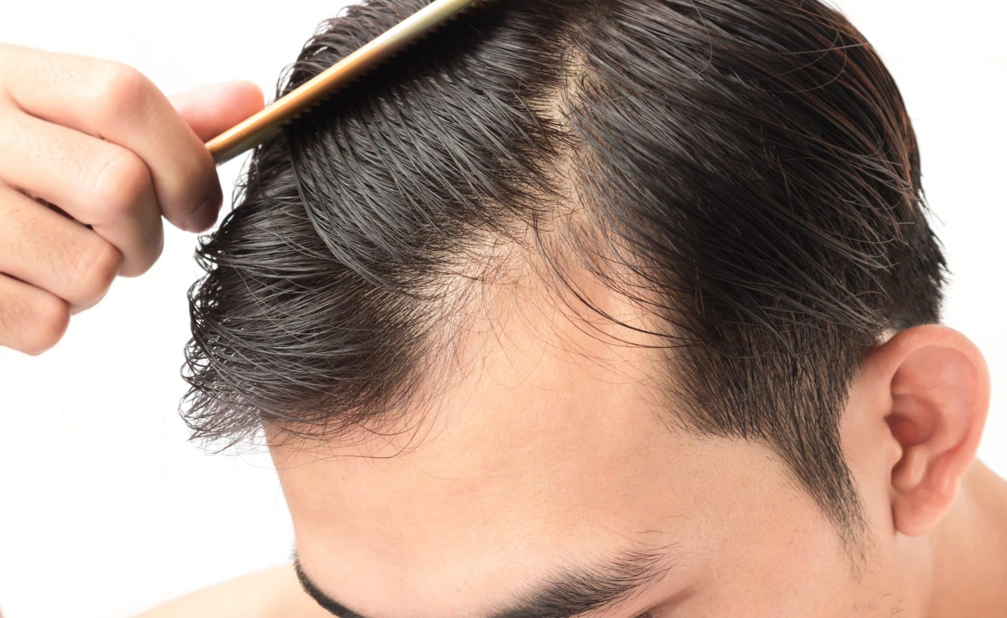 man combing through hair